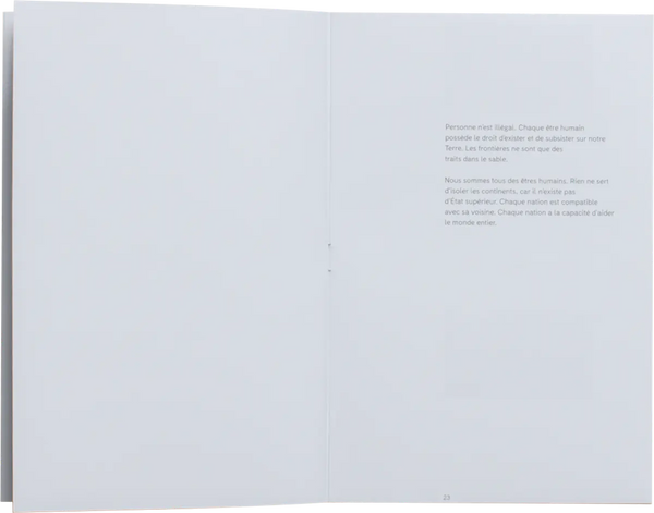Open book. Simple layout with text on the right page. The text is written in French and takes on the humanist idea for having a free world where everyone can belong anywhere. 